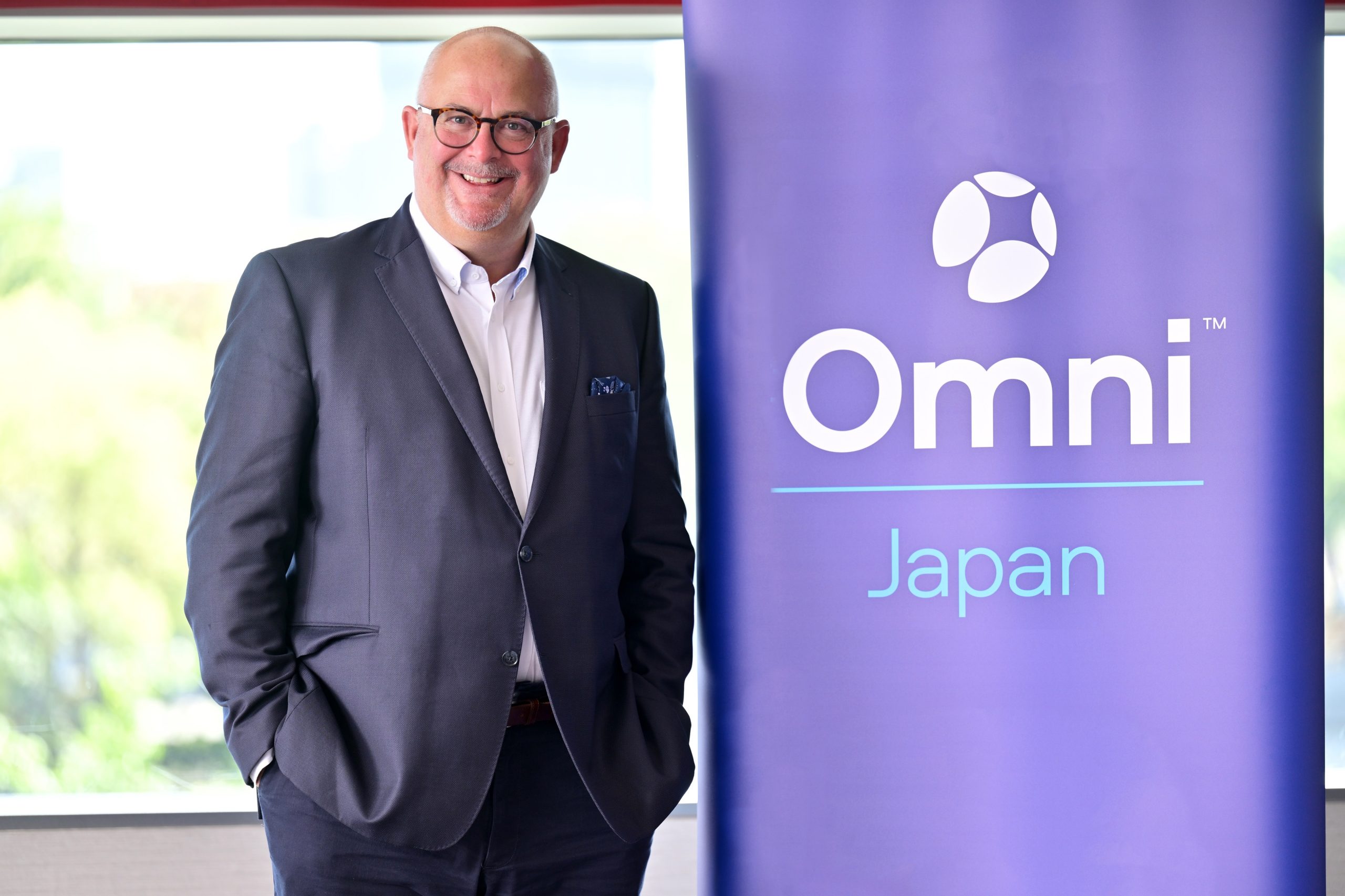 Kingsley Wheaton with Omni Japan banner
